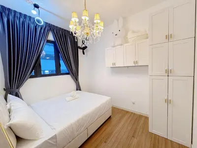 a bedroom with a bed and a window and a chandelier at Kuala Lumpur M Vertica Residence I Big Family Homestay \u5927\u5bb6\u5ead\u9002\u4f4f I Walking distance to MRT I \u9a6c\u4e2d\u82f1\u6587\u670d\u52a1 I Malay English Chinese in Kuala Lumpur