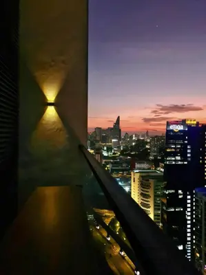 a view of a city at night from a building at The Establishment - Menara Teguh Bangsar in Kuala Lumpur