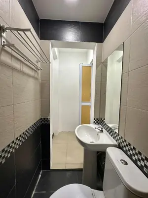 a bathroom with a sink and a toilet at Homigo - PWTC in Kuala Lumpur