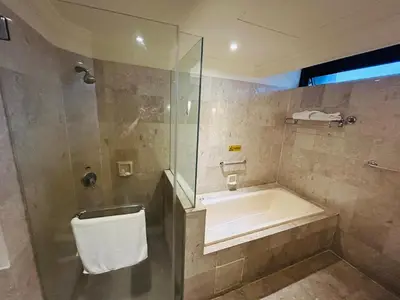 a bathroom with a tub and a sink and a shower at EVERYDAY SERVICE SUITE at TIMES SQUARE in Kuala Lumpur