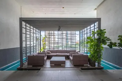 a living room with a couch and a large window at One Bukit Ceylon AT Bukit Bintang Kuala Lumpur in Kuala Lumpur