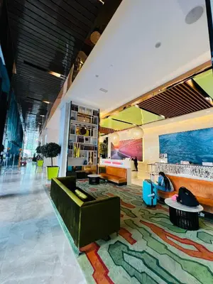 a living room with a couch and a rug at The Platinum KLCC by Dream Suites in Kuala Lumpur