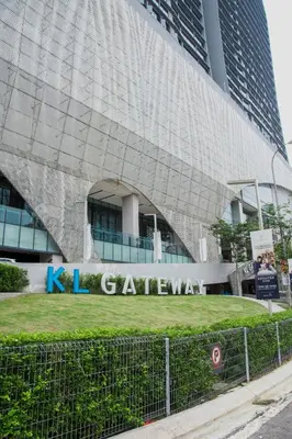 a building with a sign that reads k center at KL Gateway Bangsar by Sleepy Bear in Kuala Lumpur