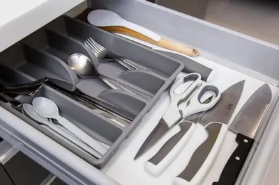 a drawer filled with silver utensils in a drawer at KL Gateway Bangsar by Sleepy Bear in Kuala Lumpur