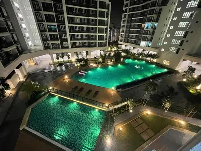an overhead view of a pool in a building at night at JMZ homestay in Kuala Lumpur