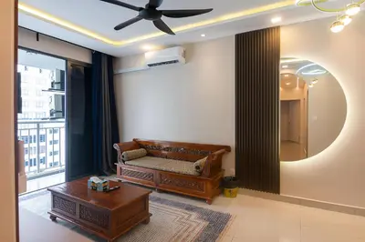a living room with a couch and a table at 3BR LSH33 KL Duke Highway Genting Free Parking in Kuala Lumpur