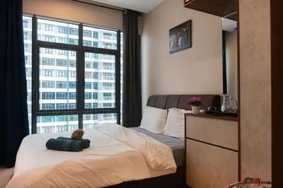 a bedroom with a bed with a teddy bear on it at 3BR LSH33 KL Duke Highway Genting Free Parking in Kuala Lumpur