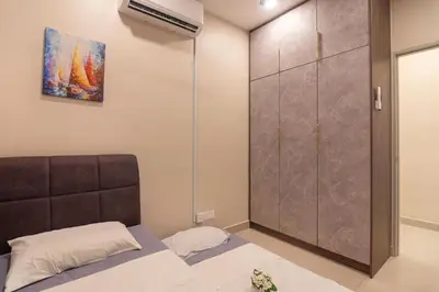 a bedroom with a bed and a closet at 3BR LSH33 KL Duke Highway Genting Free Parking in Kuala Lumpur