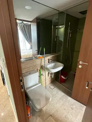 a bathroom with a toilet and a sink and a shower at Urban Sky Home with KLCC view at SKY SUITES Two Bed Rooms Apartment in Kuala Lumpur
