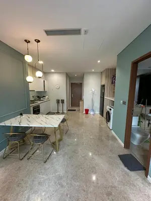 a kitchen and dining room with a table and chairs at Urban Sky Home with KLCC view at SKY SUITES Two Bed Rooms Apartment in Kuala Lumpur