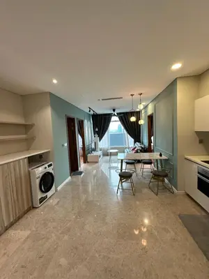 a kitchen with a table and a dining room at Urban Sky Home with KLCC view at SKY SUITES Two Bed Rooms Apartment in Kuala Lumpur