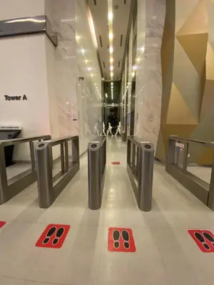 a hallway in a building with red squares on the floor at Summer Suites KLCC by Angel in Kuala Lumpur