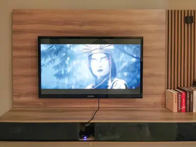 a television screen with a picture of a woman at Scenic Living Homestay Studio in Kuala Lumpur