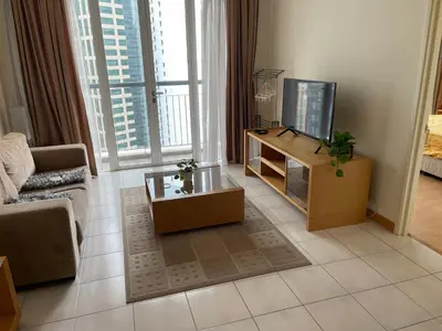 a living room with a tv and a couch at Raafah Kl suits At Seri bukit Ceylon,bukit bintang in Kuala Lumpur