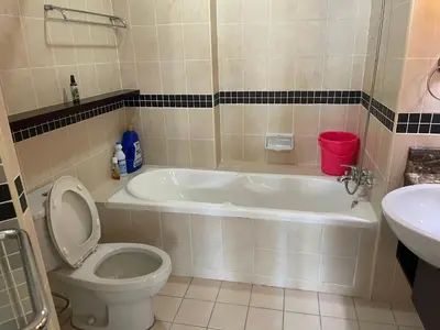 a bathroom with a toilet and a tub and a sink at Raafah Kl suits At Seri bukit Ceylon,bukit bintang in Kuala Lumpur