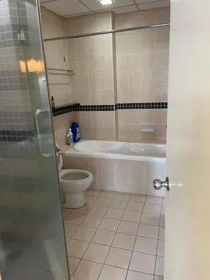 a bathroom with a tub and a toilet and a sink at Raafah Kl suits At Seri bukit Ceylon,bukit bintang in Kuala Lumpur