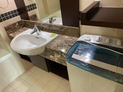 a bathroom with a sink and a counter with a sink at Raafah Kl suits At Seri bukit Ceylon,bukit bintang in Kuala Lumpur