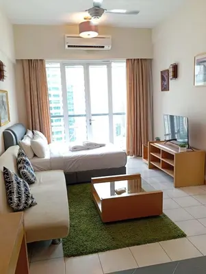 a living room with a bed and a couch at Raafah Kl suits At Seri bukit Ceylon,bukit bintang in Kuala Lumpur