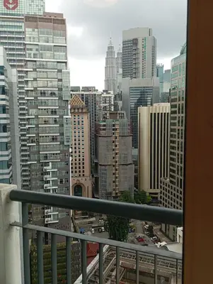 a view of a city skyline from a balcony at Raafah Kl suits At Seri bukit Ceylon,bukit bintang in Kuala Lumpur