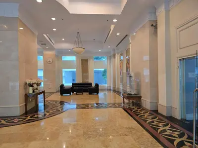 a lobby with a couch in the middle of a building at Park view klcc by Alan in Kuala Lumpur