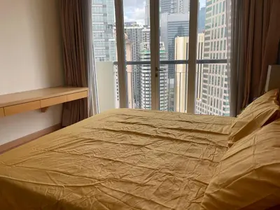 a bed in a room with a large window at City centre, Bukit Bintang in Kuala Lumpur
