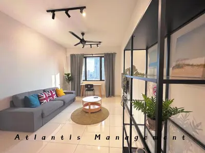 a living room with a couch and a plane flying overhead at Parc 3, Taman Pertama, Kuala Lumpur By Atlantis Management in Kuala Lumpur