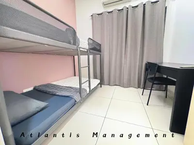 a bedroom with two bunk beds and a desk at Parc 3, Taman Pertama, Kuala Lumpur By Atlantis Management in Kuala Lumpur