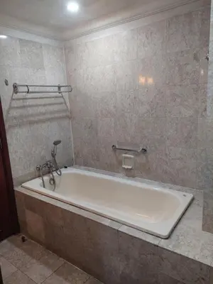a bathroom with a bath tub in a room at Snowfall suite at berjaya Times Square in Kuala Lumpur
