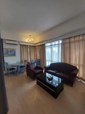 a living room with a couch and a coffee table at Snowfall suite at berjaya Times Square in Kuala Lumpur
