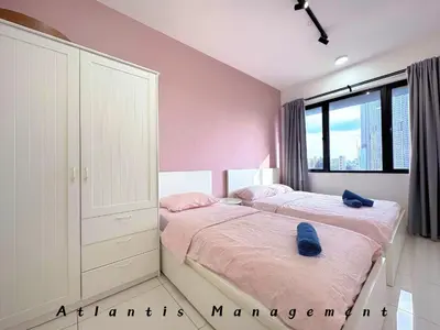 a bedroom with two beds and a large window at Parc 3, Sunway Velocity in Kuala Lumpur