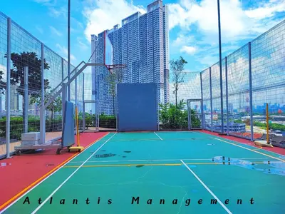 a tennis court in a city with tall buildings at Parc 3, Sunway Velocity in Kuala Lumpur