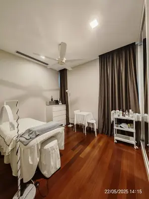 a bedroom with a bed and wooden floors and a ceiling at Icon Residence in Kuala Lumpur
