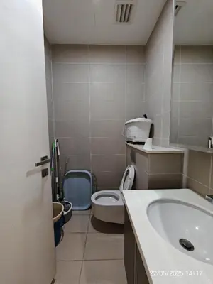 a bathroom with a sink and a toilet at Icon Residence in Kuala Lumpur