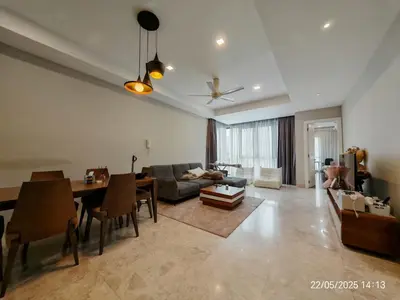 a living room with a couch and a table at Icon Residence in Kuala Lumpur