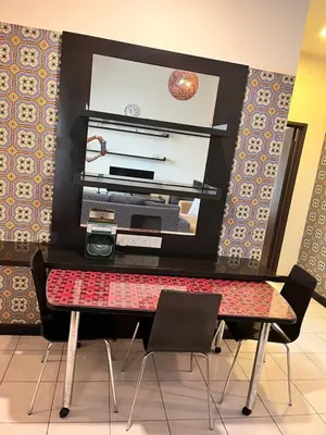 a room with a desk with a computer and chairs at Seri Bukit Ceylon Bukit Bintang in Kuala Lumpur