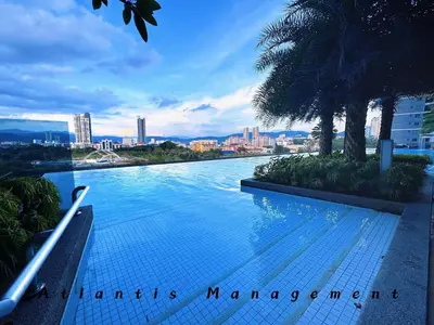 a swimming pool with a view of a city at Parc 3 KL South Cozy Apartment, Walking Distance to AEON Maluri & Sunway Velocity in Kuala Lumpur