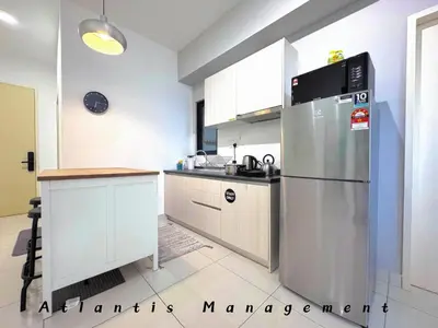 a kitchen with a stainless steel refrigerator and a sink at Parc 3 KL South Cozy Apartment, Walking Distance to AEON Maluri & Sunway Velocity in Kuala Lumpur