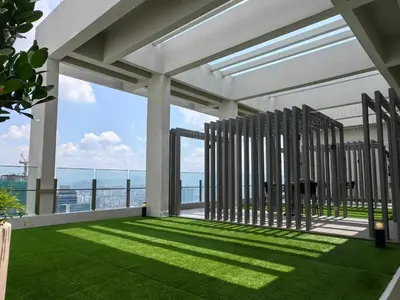 a view from the balcony of a building with grass at TRX Agile Bukit Bintang Deluxe 8 pax Family Suites in Kuala Lumpur