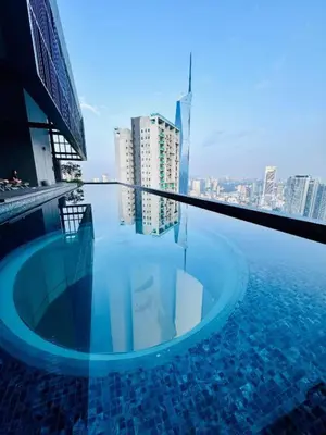 a swimming pool on the roof of a building at Lucentia Residences BBCC LaLaport in Kuala Lumpur