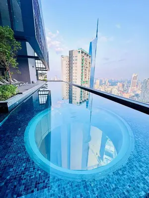 a swimming pool on the roof of a building at Lucentia Residences BBCC LaLaport in Kuala Lumpur