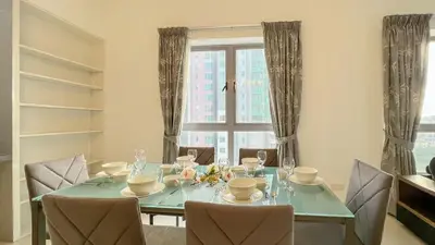 a dining room with a table and chairs and a window at Kuala Lumpur Digital Work Base in Kuala Lumpur