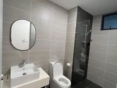 a bathroom with a sink and a toilet and a mirror at TrionKL Luxury Stay 2BR Free Wi-Fi 10min to KLCC - Chinese Host in Kuala Lumpur