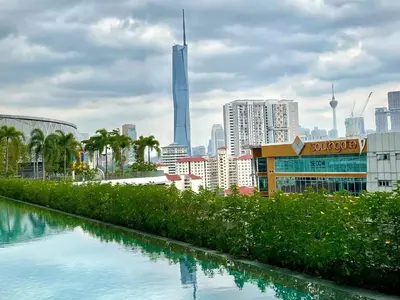 a view of a city with a river and buildings at TrionKL Luxury Stay 2BR Free Wi-Fi 10min to KLCC - Chinese Host in Kuala Lumpur