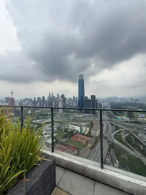 a view of a city skyline from a balcony at Continew Residence Studio Apartment in Kuala Lumpur