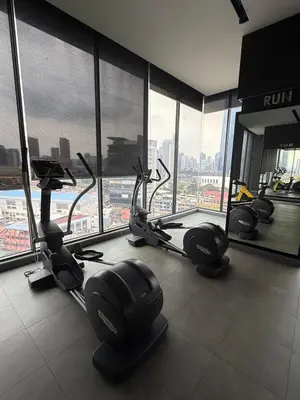 a gym with treadmills and ellipticals in a building at Continew Residence Studio Apartment in Kuala Lumpur