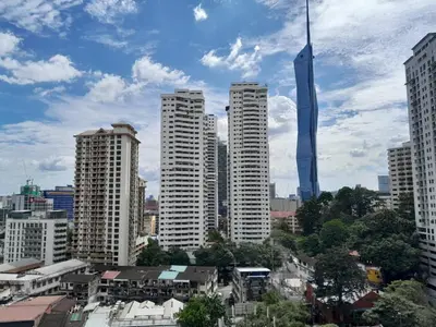 a city skyline with tall buildings and a skyscraper at AK Residence in Kuala Lumpur