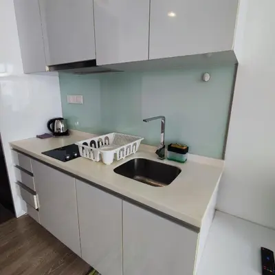 a kitchen counter with a sink and a sink at One Bukit Ceylon KLCC in Kuala Lumpur