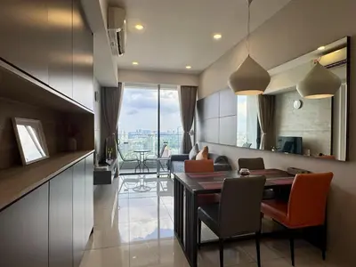 a kitchen and living room with a table and chairs at Balcony Cityscape IIII The Robertson Residence 42f in Kuala Lumpur