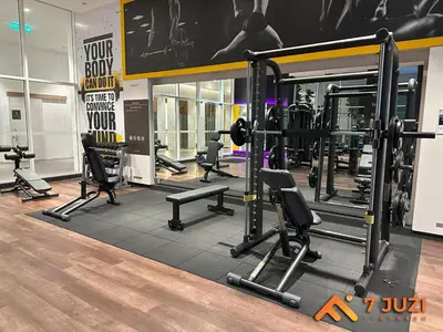 a gym with several treadmills and machines in a room at Quill Suite 1R1B Netflix HD1080 with Infinity Pool in Kuala Lumpur