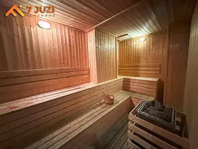an empty wooden sauna with a stove in it at Quill Suite 1R1B Netflix HD1080 with Infinity Pool in Kuala Lumpur